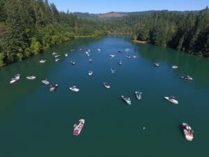 An aerial view of a lake with Supreme boats in it.