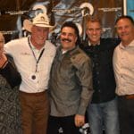 A group of people posing for a photo at a Supreme Boats event.