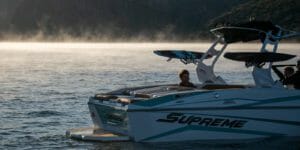 A Supreme-branded boat floating in the water.