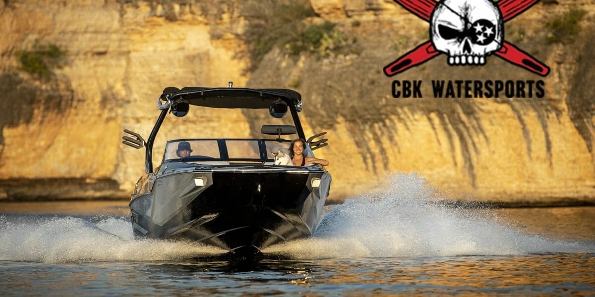 A Supreme boat with a skull and crossbones in the water.