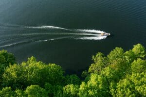 An aerial view of a Supreme boat traveling through a body of water.