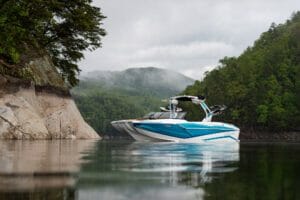 A Supreme boat in the middle of a body of water.