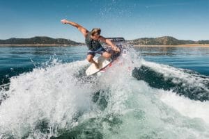 Supreme Boats rider Keenan surfing behind a boat