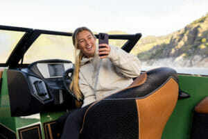 Woman taking selfie in a Supreme S240 boat