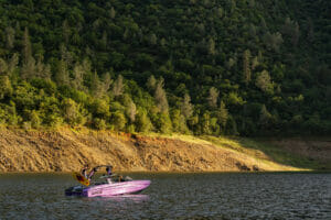 Wakesurfer getting ready to surf behind a Purple S220 Supreme boat