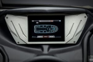 Close-up of a touchscreen control panel on a Supreme S240 displaying a boat diagram with labeled sections and options to drain, stop, or fill all compartments.