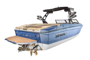 A blue and white Supreme S240 speedboat with tan seating and a rear swim platform, viewed from the back with the word "Supreme" on the side.