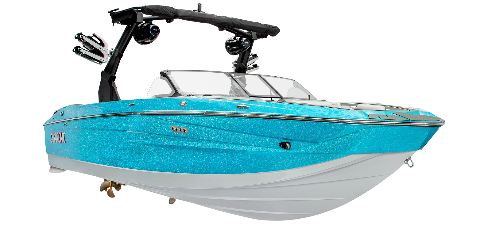 A blue and white motorboat, the Supreme S240, features a wakeboard tower, two large speakers, and a spacious seating area, shown against a white background.