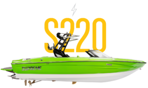 A green Supreme Towboats S220 boat with a black wakeboard tower is shown against a white background with a large yellow "S220" text above.