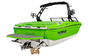 A green and white motorboat with a black canopy, the word "Supreme S220" on the side, and a stern deck equipped with seats and an outboard motor with propellers.