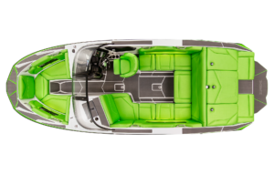 Top-down view of a sleek white and green Supreme Towboats S220 showcasing grey flooring, bright green padded seating, and a central control console with a steering wheel and instruments.