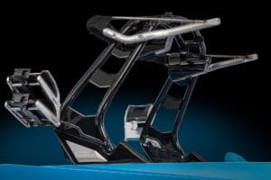 Close-up view of an intricate black and silver metallic mechanical framework on a blue background, possibly part of marine equipment like the Supreme Boats S240.