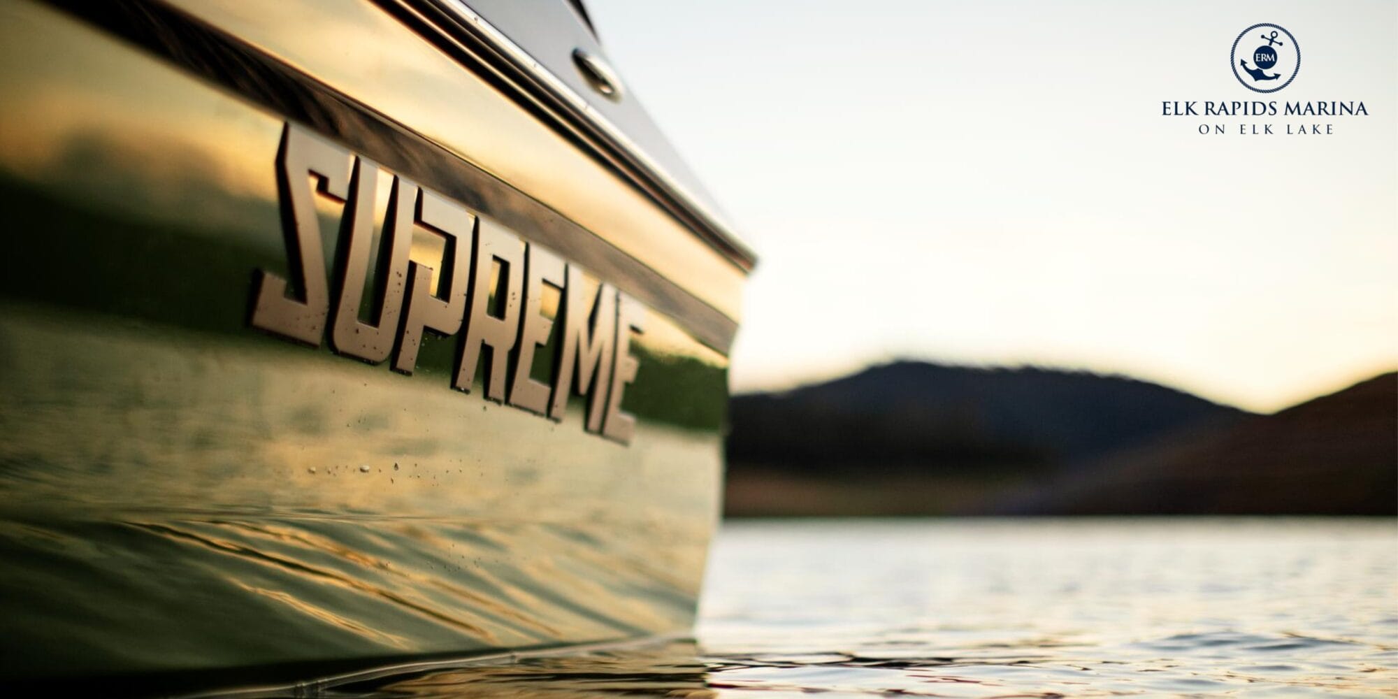 Close-up of a green Centurion boat on a lake with 