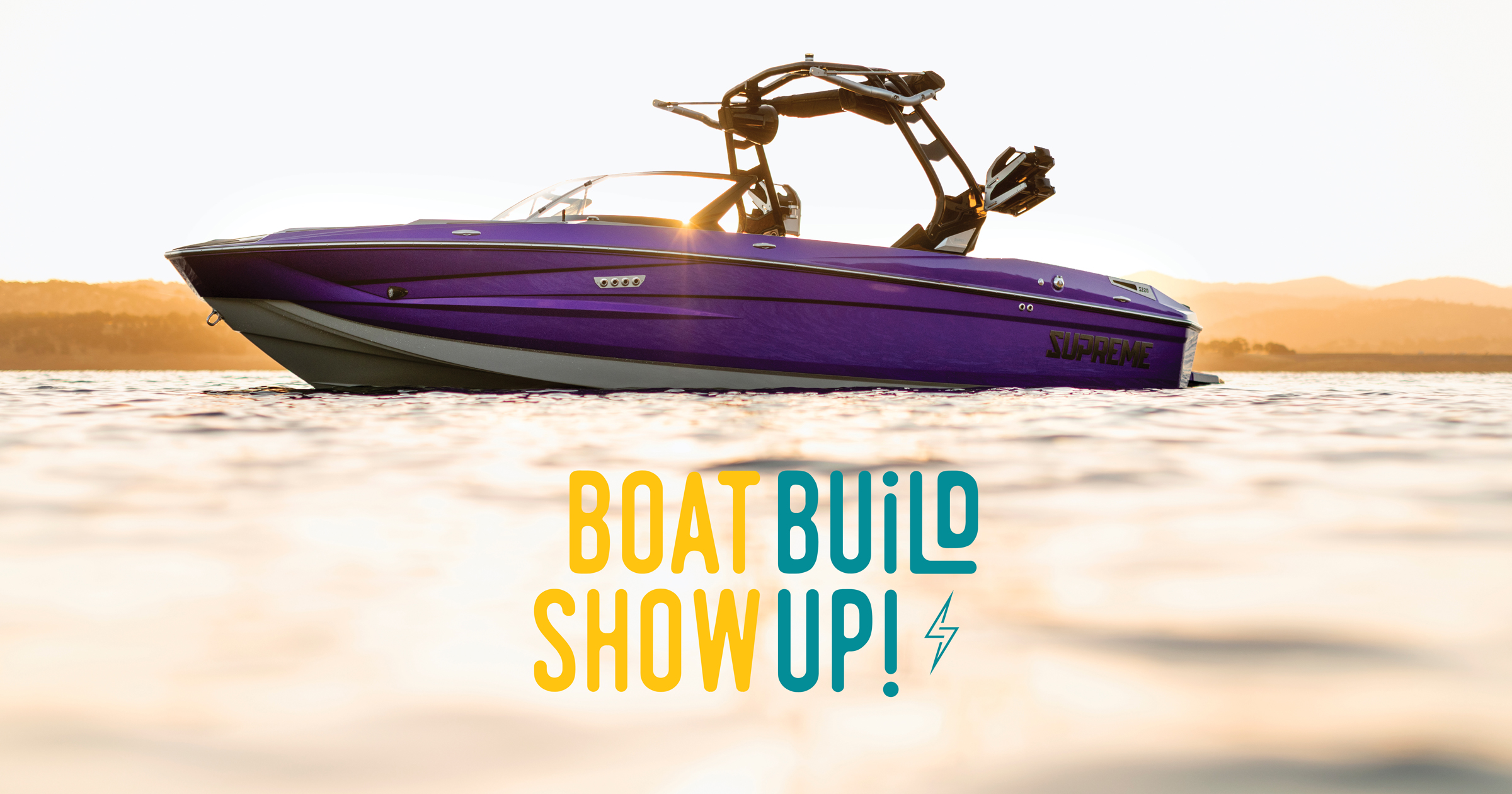 A purple speedboat floats on calm water at sunset with 